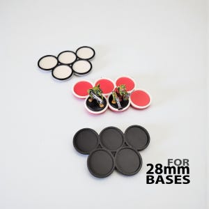 Miniature base movement tray for moving miniatures around tabletop gaming boards.