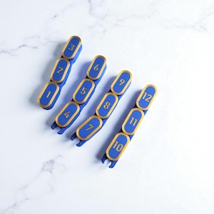 Segmented modular wargaming chain ruler in custom colors.