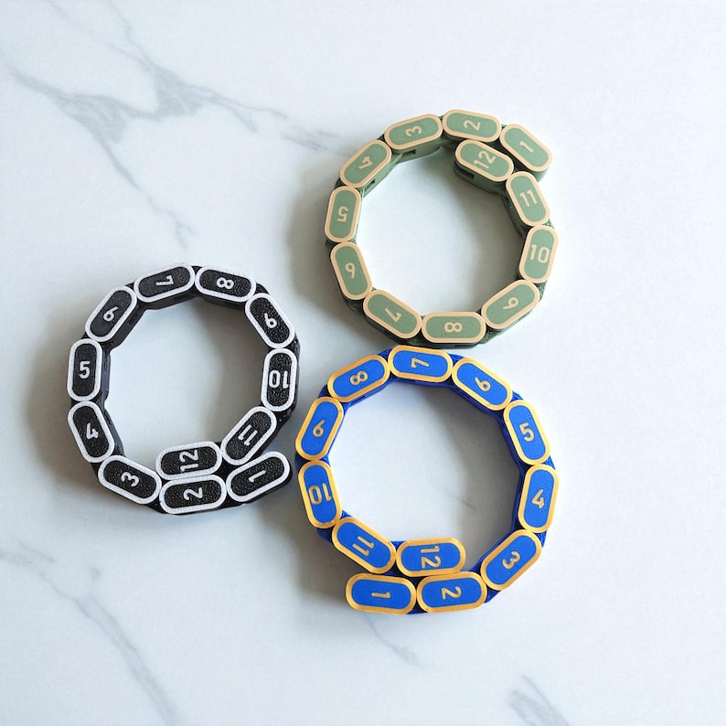 Segmented modular wargaming chain ruler in custom colors.
