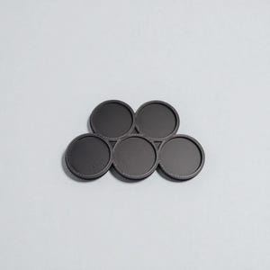 Miniature base movement tray for moving miniatures around tabletop gaming boards.