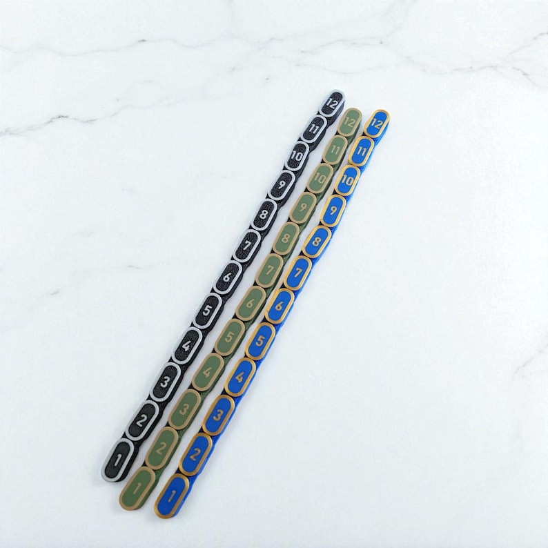 Segmented modular wargaming chain ruler in custom colors.