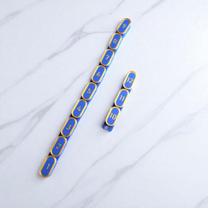 Segmented modular wargaming chain ruler in custom colors.