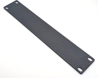 May include: A long, rectangular, dark gray metal plate with a textured surface. The plate has two rounded holes at one end and two square holes at the other end. The plate is designed for mounting or structural support.