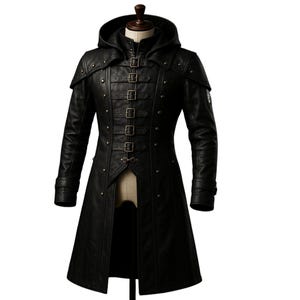May include: A long black leather coat with a hood, featuring a decorative buckle closure and studded accents.
