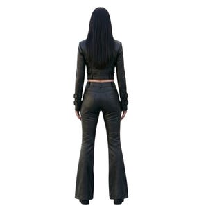 May include: A black leather outfit consisting of a cropped long-sleeve jacket and matching flared trousers. The jacket features a fitted silhouette, while the trousers have a high-waisted design with a flared leg cut, both in a solid black finish.