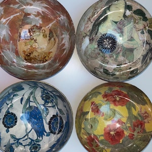 May include: Four decorative bowls with different floral and nature-inspired designs. The bowls are made of a clear material with a glossy finish. The designs are printed on the inside of the bowls, creating a unique and eye-catching effect.