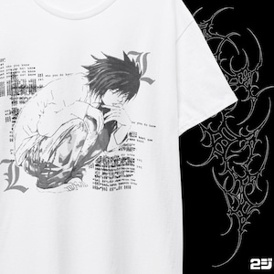 May include: White t-shirt featuring a black and white anime-style illustration of a person in a squatting position. The design includes text and the letter "L". The right side of the shirt has a white tribal design on a black background.