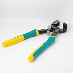May include: Tile nippers with black jaws and teal and yellow handles. The tool has a spring and a metal hinge. The handles are teal with yellow ends. The tool is designed for cutting tiles.