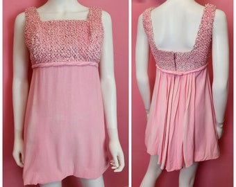 Size Small | Vintage 1960's Bubblegum Pink Micro Mini Babydoll Dress with Textured Bodice and Bow