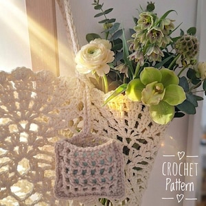 May include: A white ceramic mug with a black handle and the text "But First, Coffee" in a black, handwritten-style font. The mug is sitting on a wooden surface.