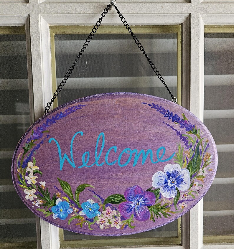 Oval Wooden Welcome Sign With Pansies. Purple Shimmer Background ...