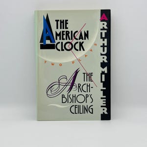 May include: A hardcover book titled "The American Clock" and "The Archbishop's Ceiling" by Arthur Miller. The cover is light green with black, blue, and red text and design elements. The book is a collection of two plays.