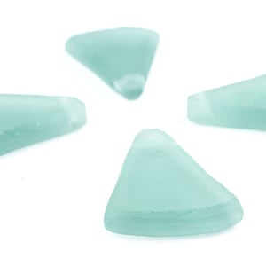 May include: Four light blue glass pieces shaped like triangles with rounded edges.