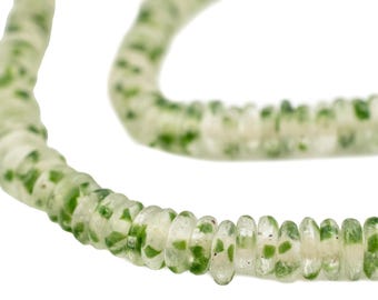 May include: A necklace composed of translucent, light green beads with darker green speckles. The beads are round and strung together, creating a curved shape against a white background. The necklace appears to be made of glass or a similar material.