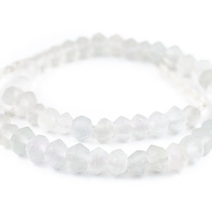 May include: A strand of white glass beads with a faceted, irregular shape. The beads are strung on a thin, white cord.
