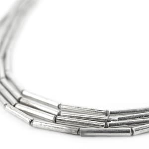 Minimalistiska glänsande silverpärlor i rörform: Vit metall 1,5 mm pärltillbehör bild 1