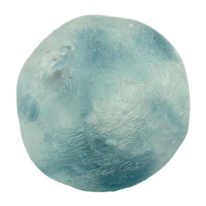 May include: A rounded, light blue gemstone with a textured surface. The stone has a cloudy appearance with variations in color, and is set against a white background. The overall shape is irregular and organic.