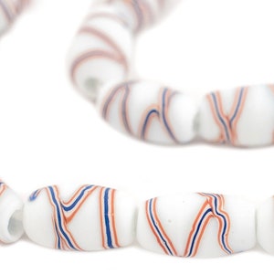 May include: A strand of white glass beads with blue and orange swirl patterns.