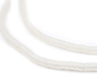 May include: A strand of white, opaque, round beads, strung together to form a necklace.
