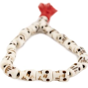White Bone Skull Bead Bracelet with Red Tassel – Hand Carved Water Buffalo Beads, Unisex Gothic Boho Jewelry, Stacking Bracelet from Nepal