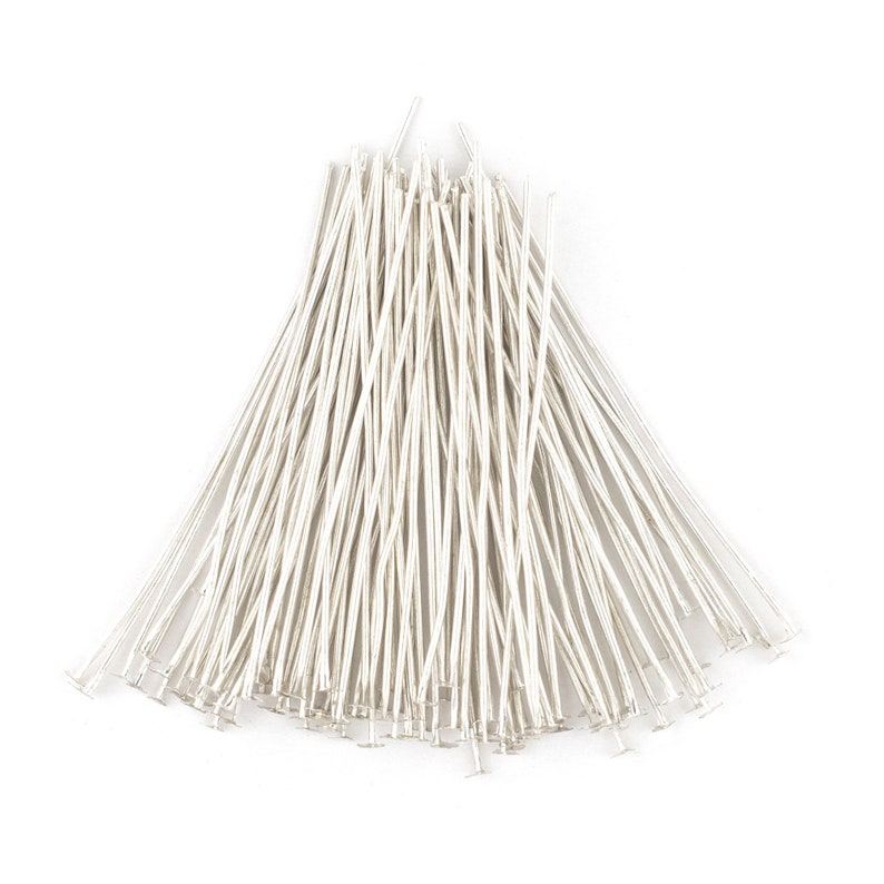 May include: A large bundle of silver head pins, used for jewelry making and crafting.