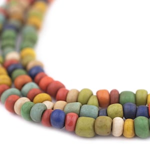 May include: Three strands of colorful, square-shaped beads in a variety of colors including red, blue, green, yellow, and cream. The beads are strung together, creating a necklace or bracelet.