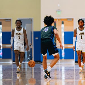 May include: Two basketball players on a court, one wearing a white jersey with the number 1 and the word "LIONS" on it, the other wearing a green jersey with the number 4. Both players are dribbling basketballs.