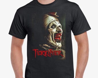 May include: Black t-shirt with a graphic of a scary clown with red paint on its face and the word "TERRORIZER" in red letters.