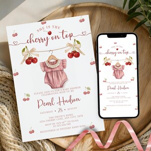 May include: A baby shower invitation and a smartphone displaying the same design. The invitation features the text "She is the cherry on top" with cherry illustrations and a pink baby onesie. The invitation includes the name "Pearl Hudson".