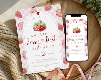 May include: A pink and white strawberry-themed invitation and a smartphone displaying the same design. The invitation reads "Amelia's berry first birthday" with details for the event. The design includes strawberries and a gingham pattern.