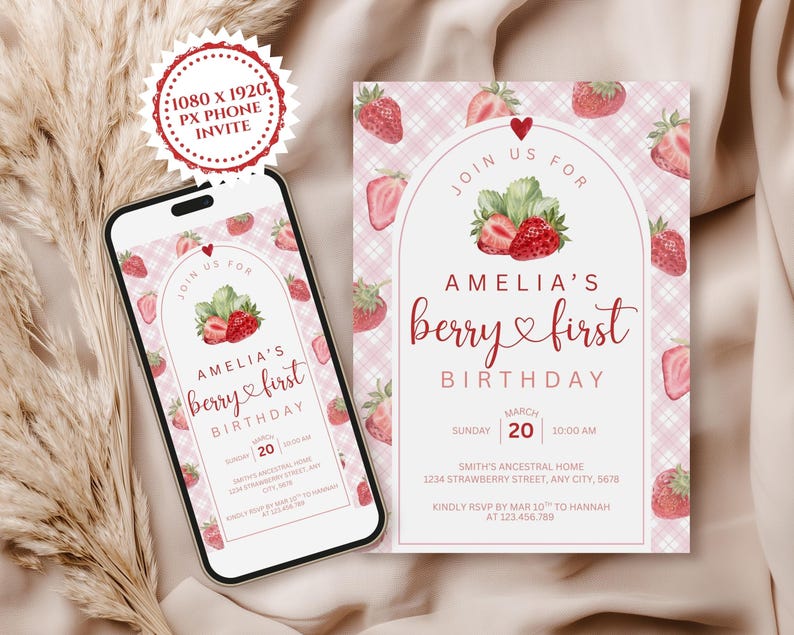 May include: A digital invitation for a first birthday, featuring a strawberry theme. The design includes a smartphone displaying the invitation and a printed card. The invitation reads "Amelia's berry first birthday" with details.