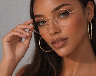 Gafas de estilo vintage color cobre dorado con montura ligera y fina.