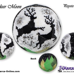 May include: A black and white beaded reindeer moon ornament with green and gold accents. The ornament is 15 rows of beads and is a peyote ball.
