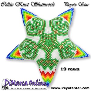 May include: A green, white, and gold beaded star with a Celtic knot shamrock design. The star is 19 rows tall and has a rainbow border. The text "Celtic Knot Shamrock Peyote Star" is at the top of the image. The text "DiMarca Online SEED BEAD & CRYSTAL SPECIALIST" is at the bottom of the image. The text "19 rows" is in the lower right corner of the image. The text "www.PeyoteStar.com" is in the lower right corner of the image.