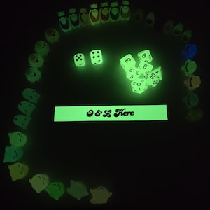 Assorted Glow in the dark dice and figurines