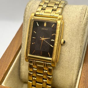 Seiko gold tank watch with black dial vintage style quartz