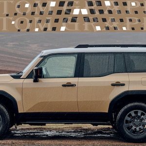 May include: Tan SUV with black detailing and wheels. The vehicle features a white roof and a patterned rear window. The text "CUSTOM GRAPHICS" is displayed across the top of the image.