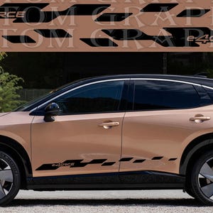 May include: A gold-colored SUV with black accents and a black "e-FORCE" decal on the side. The car has black wheels and a black roof.