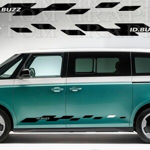 May include: A teal and white Volkswagen ID.Buzz van with black graphic decals. The decals feature the text "ID.BUZZ" and geometric shapes. The van has black wheels and tinted windows. The decals are on the side and above the van.