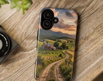 May include: A smartphone case featuring a printed landscape image of a rural farm scene with a dirt road, a red barn, green pastures, grazing cattle, and rolling hills under a sunset sky with clouds, designed with a dual camera cutout.