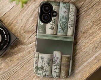 May include: A smartphone case featuring a printed design of two shelves filled with vintage-style books. The book spines are decorated with detailed botanical illustrations of various flowers and plants in muted green, white, and brown tones.