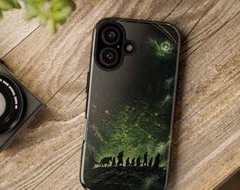 May include: A black smartphone case featuring a dark green, atmospheric graphic of a group of nine silhouetted figures walking across a rugged landscape under a glowing, celestial-like map pattern in the night sky.
