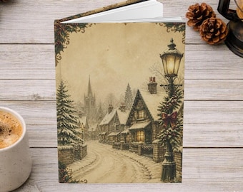 May include: A hardcover book featuring a sepia-toned illustration of a snow-covered village street with a lit lamp post in the foreground, decorated with a red bow and greenery, set against a backdrop of houses and a church steeple.