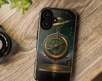 May include: A black smartphone case featuring a detailed graphic of a golden navigational compass floating above a circular platform, set against a dark starry sky with a planet and rings visible in the background.