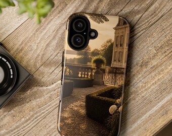 May include: A smartphone case featuring a printed image of a formal garden at sunset, showing a stone building, a stone balustrade, manicured hedges, and a potted plant. The case has a black camera cutout area with two circular lenses.