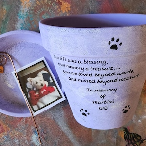 Hand painted terracotta pet loss planter with matching saucer.  Shown in lavender.