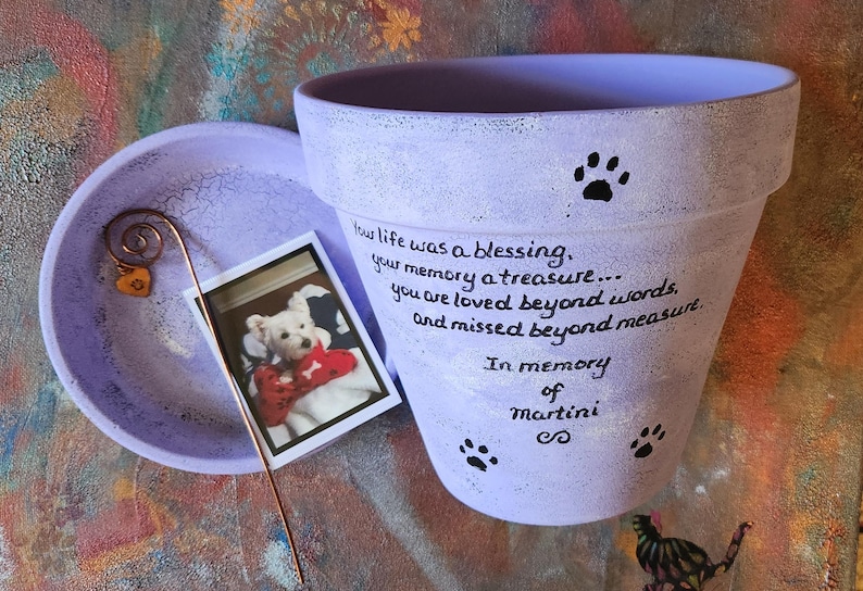 Hand painted terracotta pet loss planter with matching saucer.  Shown in lavender.