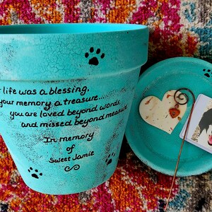 hand painted pet loss garden planter memorial with personalized wording and pets name.  shown in turquoise.