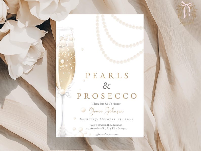 May include: A white invitation card with gold text that reads "Pearls & Prosecco" and features a glass of champagne with pearl accents. The invitation is for a party to honor Grace Johnson on Saturday, October 25, 2025, at four o'clock in the afternoon. The address is 1213 Anywhere St., Any City, St 12345. The invitation also states that the event is registered at Amazon.