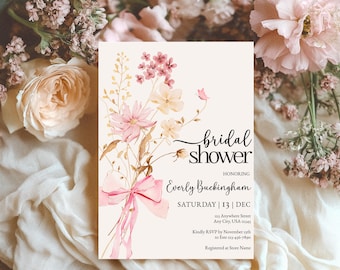 May include: A floral bridal shower invitation with a watercolor bouquet of pink and white flowers tied with a pink ribbon. The text reads "bridal shower honoring Everly Buckingham Saturday | 13 | DEC 113 Anywhere Street Any City, USA 12345 Kindly RSVP by November 13th to 123-456-7890 Registered at Store Name"